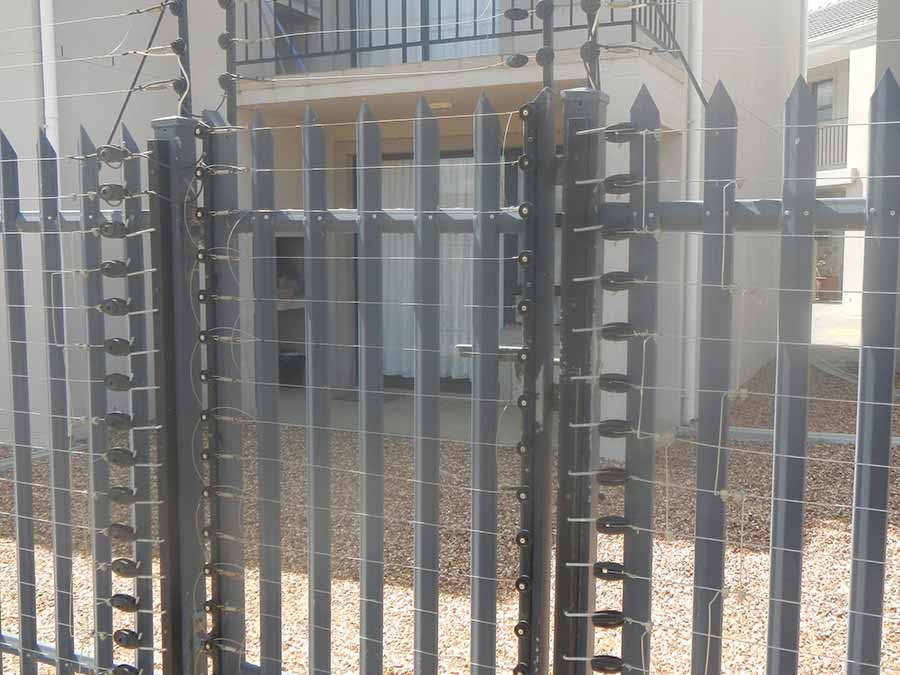 Electric fence securing a gate